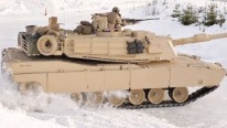 United States Army Forces: M1A1 Battle Tank Drifts in Snow