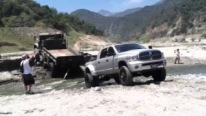 CUMMINS POWER - 6.7L Cummins Powered Pickup Pulls Out another Truck Stuck in the Mud