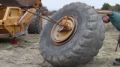 This Is How to Remove a Huge Tire Off a Scraper